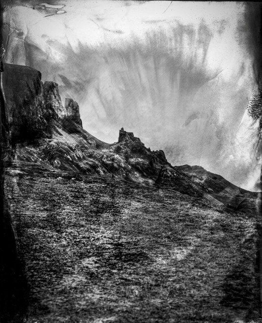 The Quiraing landslip photographed via a Victorian-style method. See SWNS story SWNAphoto. A photographer is scaling a mountain to take incredible Victorian style pictures using a rare process - invented nearly 200 years ago. Simon Riddell, 41, took up wet plate collodion in 2020 to help with his mental health and said the complicated process is used by just a handful of people around the world. Invented in 1851, it sees photographic material, usually glass or aluminium coated in collodion, sensitised in a silver nitrate bath, and developed within ten minutes.