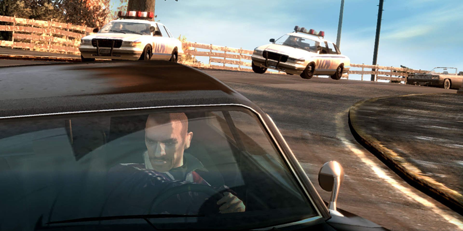 Grand Theft Auto 4 character driving car with 2 police cars behind him