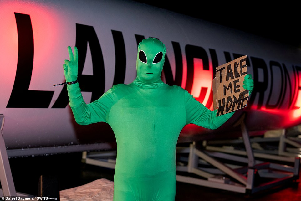 Viewers attending the launch included Adrian Grint, a 46-year-old IT consultant from St Austell in Cornwall, who dressed as a green alien. He held a sign saying 'take me home'