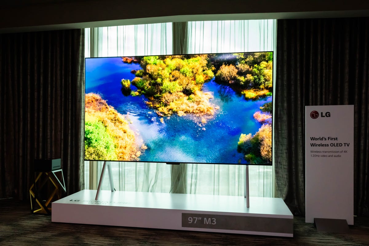 LG's 97-inch wireless M3 OLED TV on a stand.