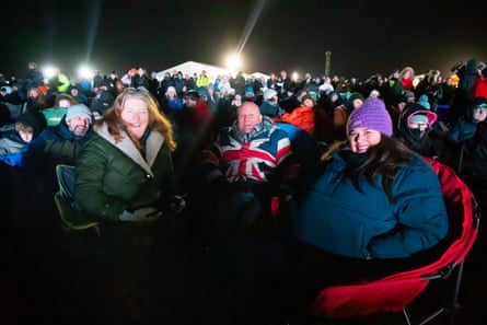 Members of the public watch and wait for news of Cosmic Girl