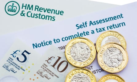 HMRC self-assessment notice to complete a UK tax return, with new pound coins and notes