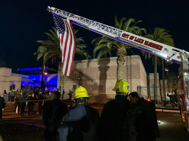 A Lake Elsinore firetruck hoists a flag Tuesday, Jan. 17,...