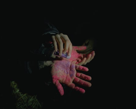 Activists sprinkle glitter on their hands after rubbing them with glue. Many activists prick their fingertips with a needle and seal the fingertips with glue to make it harder for police to identify them