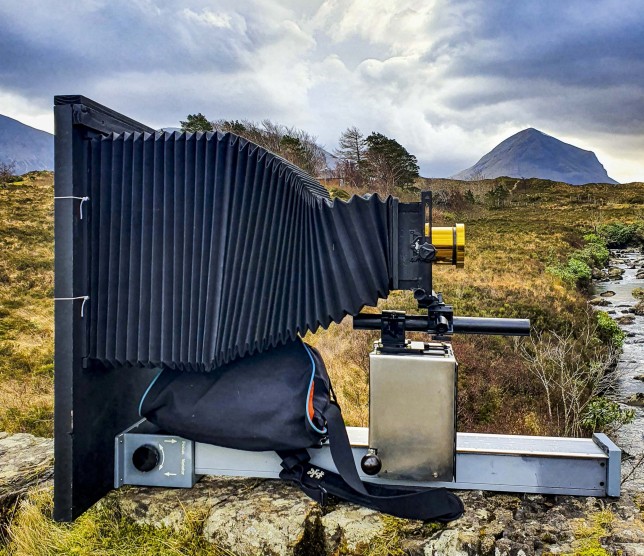 Simon's equipment on the mountain side which he uses to create incredible Victorian-style photos. See SWNS story SWNAphoto. A photographer is scaling a mountain to take incredible Victorian style pictures using a rare process - invented nearly 200 years ago. Simon Riddell, 41, took up wet plate collodion in 2020 to help with his mental health and said the complicated process is used by just a handful of people around the world. Invented in 1851, it sees photographic material, usually glass or aluminium coated in collodion, sensitised in a silver nitrate bath, and developed within ten minutes.