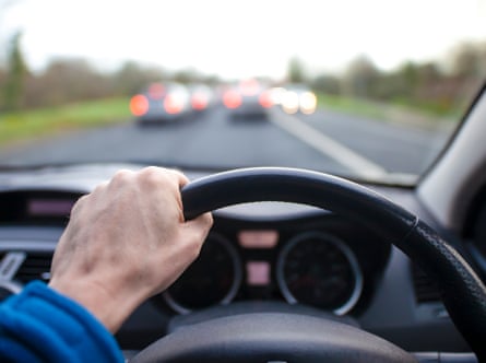 Driver’s hand on steering wheel