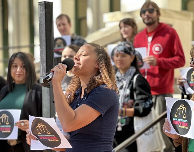 Act4SA Executive Director Ananda Tomas speaks to supporters of the Justice Charter during a rally in 2022. - Michael Karlis