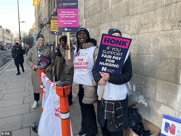 Nurses protesting pay and conditions take industrial action at St Mary's Hospital in London on February 6