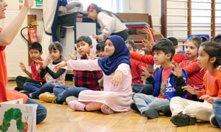 Children sit and gesture