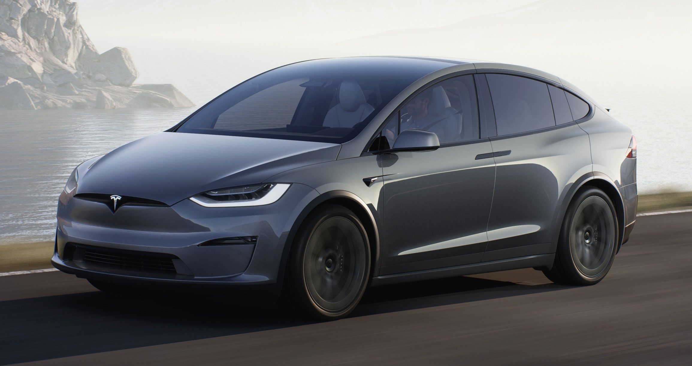 Gray 2022 Tesla Model X driven on the road