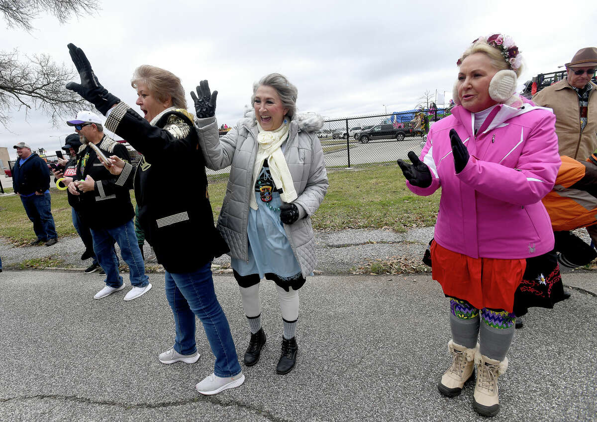 The crowd waves as the Munchkin Parade gets underway during Mardi Gras on the Sabine Saturday in Orange. Photo made Saturday, February 11, 2023 Kim Brent/Beaumont Enterprise