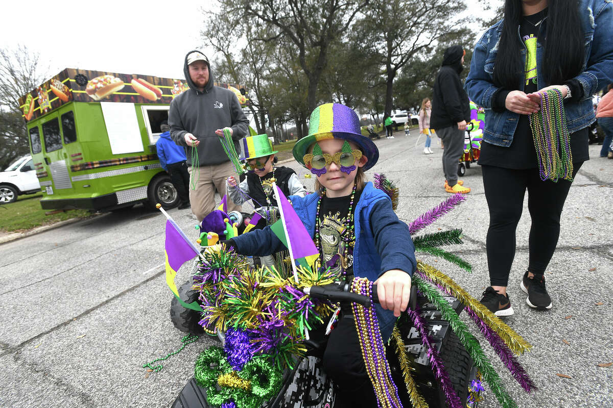 Decorated cycles make their way down the path during the Munchkin Parade as Mardi Gras on the Sabine gets underway Saturday in Orange. Photo made Saturday, February 11, 2023 Kim Brent/Beaumont Enterprise