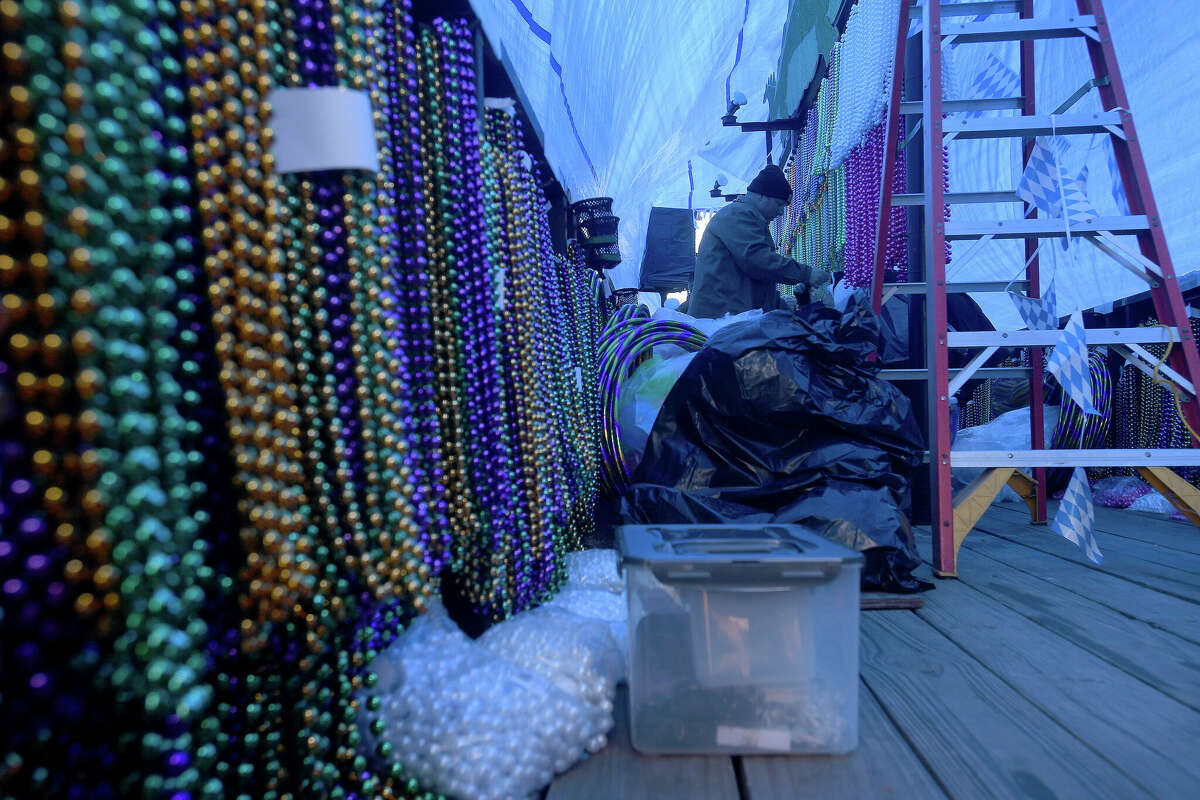 An Oktoberfest themed krewe float gets inside decorations as final touches are put on the floats for the night parade during Mardi Gras on the Sabine Saturday in Orange. Photo made Saturday, February 11, 2023 Kim Brent/Beaumont Enterprise