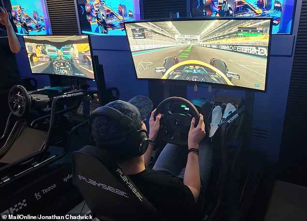 McLaren Shadow driver Lucas Blakeley demonstrates the simulators used during the successful F1 Esports campaign of 2022 at McLaren Technology Centre, Surrey