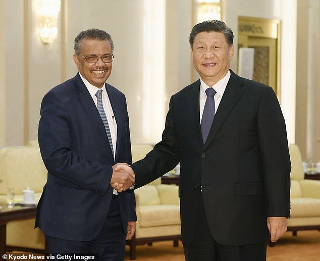 World Health Organization Director General Dr Tedros Adhanom Ghebreyesus (L) and Chinese President Xi Jinping shake hands in Beijing on Jan. 28, 2020, ahead of their meeting to discuss how to curb the spread of then new coronavirus. Dr Tedros famously defended China's 'transparency' during the initial weeks of the Covid outbreak with Sir Duncan Smith now saying today that the body needed to restructured so that it is no longer dominated by China