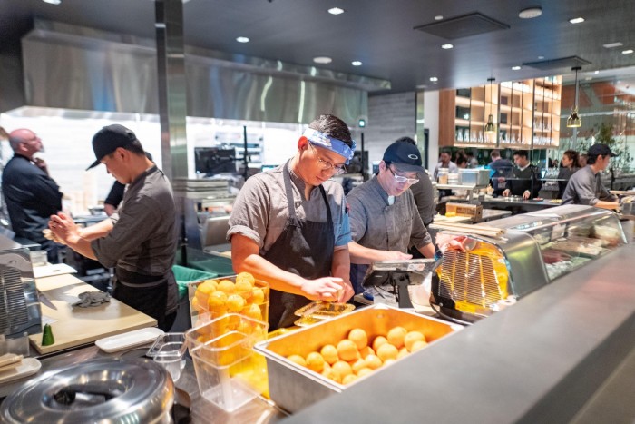 Staff at B Corp-certified Bamboo Sushi in California. Companies gain B Corp status based on how they score on metrics across governance, treatment of workers and customers, community and the environment 