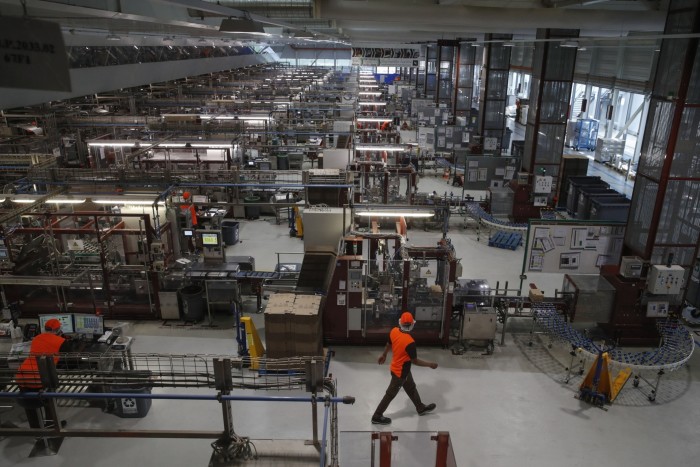 Staff work on a Nespresso production line in Switzerland. Some critics of the company’s B Corp status point to allegations that some of its farmers are earning poverty incomes and that its capsules create huge amounts of waste