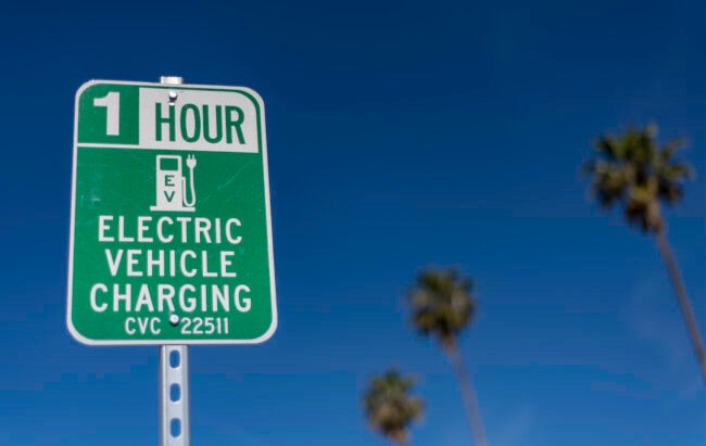 iStock-1315626956 problems with electric cars Electric Car Charging Station Sign