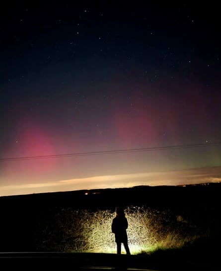 Alex’s daughter watches the northern lights near Woburn, Bedfordshire.