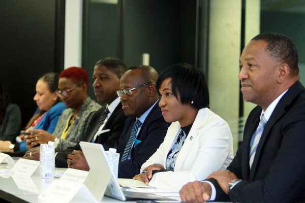 The Bahamian delegation led by DPM Cooper listens intently to company executives sharing their thoughts on how The Bahamas can become an innovation center.