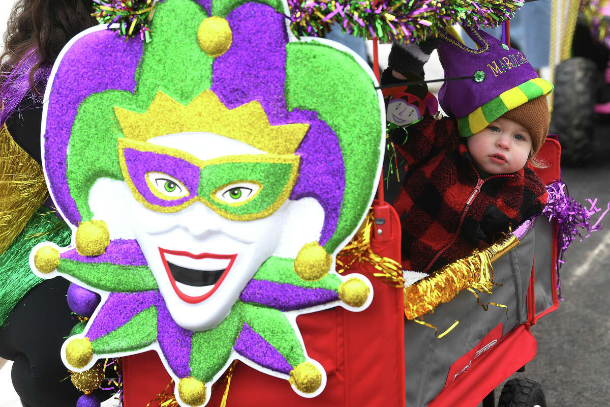 Wilder Rogillio peers out from his decorated cart as he and family wait to join in the Munchkin Parade during Mardi Gras on the Sabine Saturday in Orange. Photo made Saturday, February 11, 2023 Kim Brent/Beaumont Enterprise