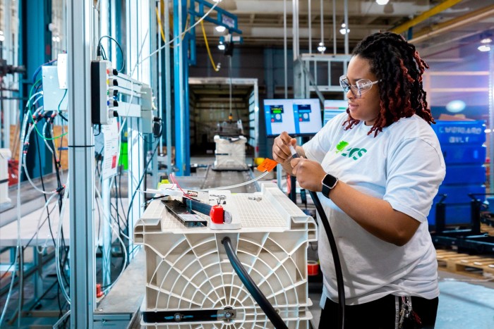 A woman works at the Eos battery making facility in Turtle Creek, Pennsylvania, which plans to double its capacity to 3 gigawatt-hours in 2024, producing a battery every 90 seconds