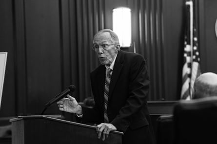 man gestures as he speaks in courtroom