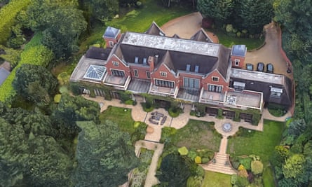 A rear view of Park Hill in Surrey. The eight-bedroom home is set in 2.6 acres of mature landscaped gardens.