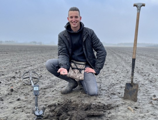 A Dutch historian uncovered a 1,000-year-old buried medieval golden treasure while searching with a metal detector. Treasure hunter Lorenzo Ruitjer discovered the incredible haul of four golden ear pendants, two strips of gold leaf and 39 silver coins in the small northern city of Hoogwoud. The Dutch National Museum of Antiquities revealed Ruijter s haul from 2021 after taking years to clean, investigate and date the treasure s objects. They found the newest coin can be dated back to around 1250, which makes them believe the treasure was buried around then. The jewellery was already 200 years old by then, with the museum saying it must already have been an expensive and cherished possession . Although the museum cannot say exactly why the treasure was buried, it pointed out there was a war raging between the Dutch regions of West Friesland and Holland in the middle of the 13th century, with Hoogwoud as the epicenter. Ruijter, 27, who has been treasure hunting since he was 10, has a theory that someone powerful buried the valuable objects as a way to protect them and planned to dig them up again when it was safe. He said: It was very special discovering something this valuable, I can t really describe it. I never expected to discover anything like this. The treasure has been loaned to the Dutch National Museum of Antiquities because of its archaeological significance, but will officially remain the property of Ruitjer. *BYLINES: IMAGES 01-10: Archeologie-Friesland/Fleur Schinning/Mega IMAGE 11: Marissa van Straaten/Mega. 14 Mar 2023 Pictured: Treasure hunter Lorenzo Ruijter, who uncovered a buried 1,000-year-old medieval golden treasure with a metal detector in Hoogwoud, Netherlands. *BYLINE: Marissa van Straaten/Mega. Photo credit: Archeologie-Friesland/FSchinning / MEGA TheMegaAgency.com +1 888 505 6342