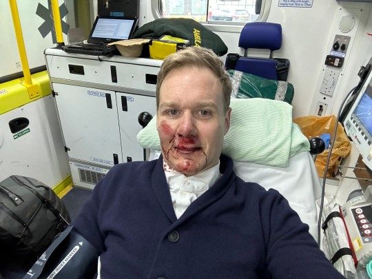 Presenter Dan Walker in an ambulance following his accident 