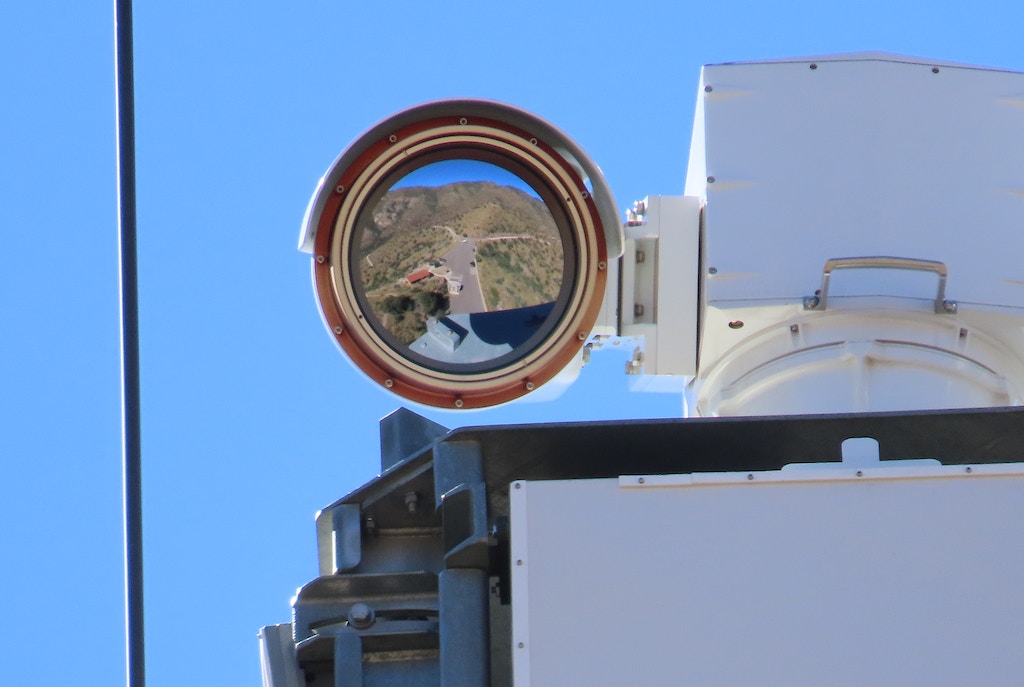 A close-up shot of an IFT’s camera lens, reflecting the desert landscape that it looks over below Coronado Peak, Cochise County, AZ.