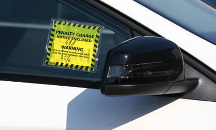 A car is seen with a parking ticket in the UK