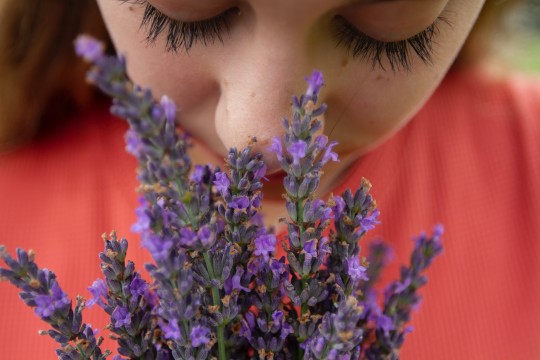 Girl smelling flowers