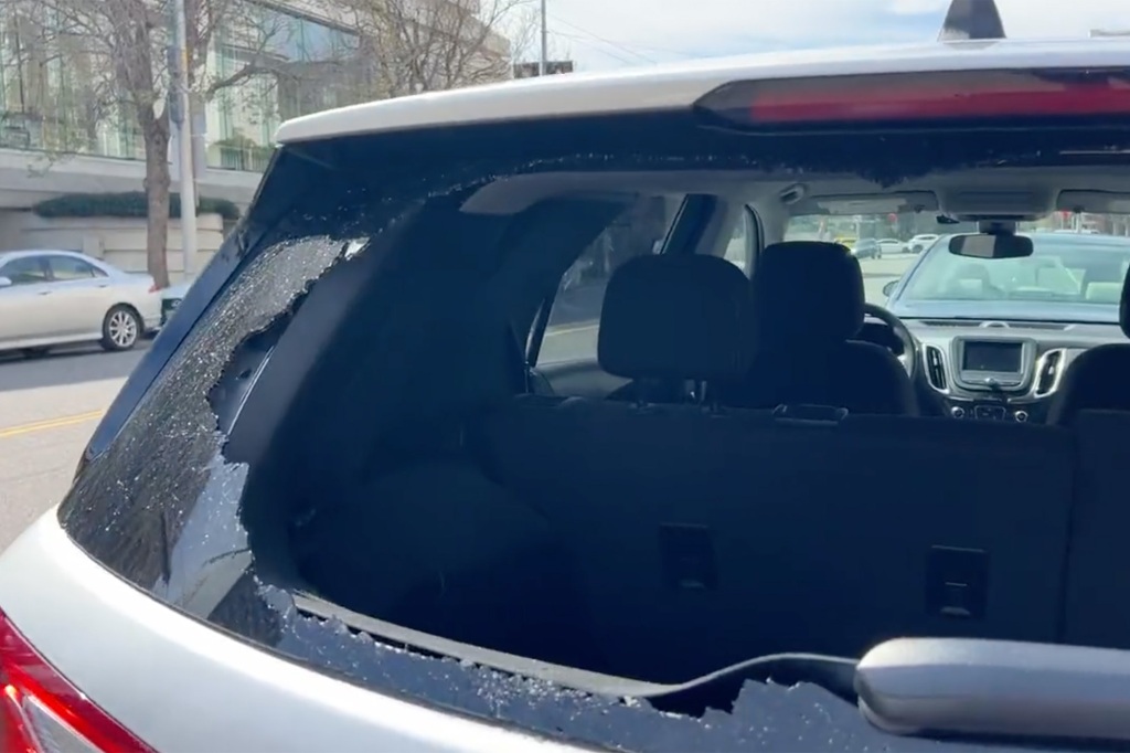 The reporter talked about the break-in with a picture of the car's shattered rear-view window.