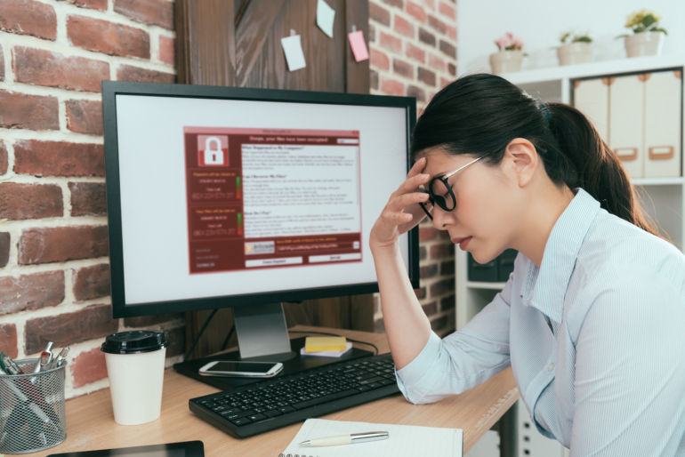 A worker discovering a ransomware attack.