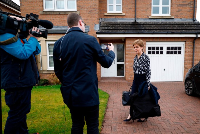 Scotland’s first minister Nicola Sturgeon speaks to reporters outside her home on Saturday