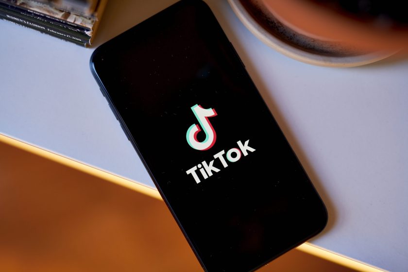 The TikTok logo on a smartphone.