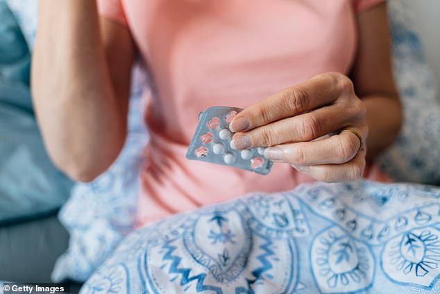 A Mail on Sunday investigation revealed concerns about Dr Louise Newson's clinic, which prescribes doses of HRT above the licensed limits to one in five of its patients (file photo of woman taking HRT pills)