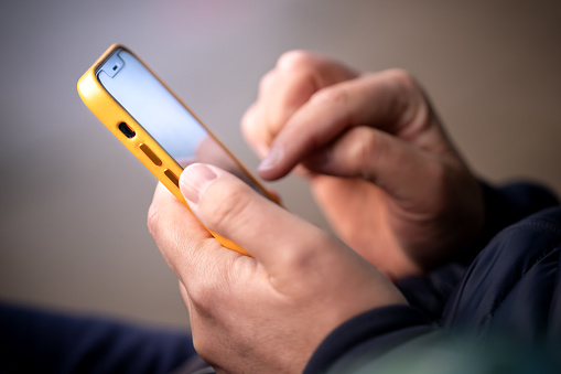 A man texting on a mobile phone