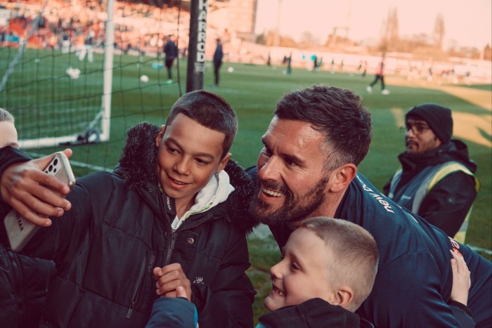 Goalkeeper Ben Foster poses for selfies with fans