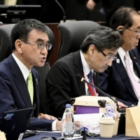 Digital minister Taro Kono (left) speaks at a meeting of Group of Seven digital and technology ministers in Takasaki, Gunma Prefecture, on Sunday. | KYODO