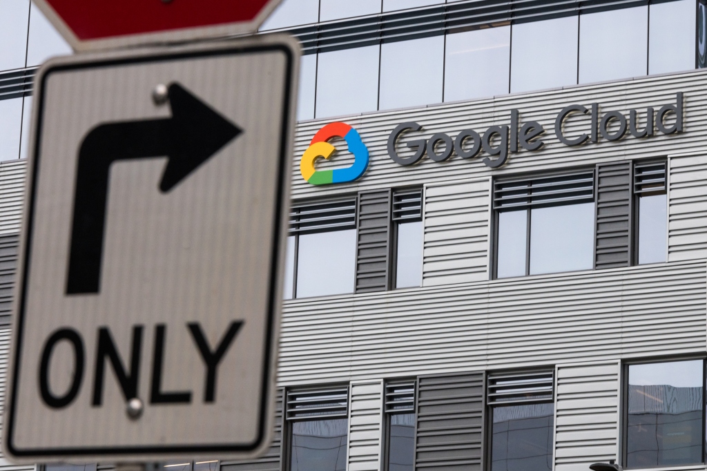 2020: The new Google Cloud building entrance in the south lake union late in the day with a right turn only street sign across the street.