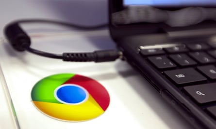 The Google logo is seen alongside a Chromebook laptop at a Currys and PC World store