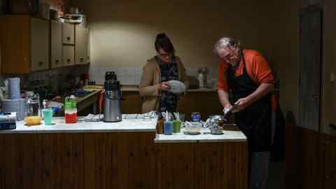 Volunteers prepare food in the kitchen of the Kingsland Community Centre in Southampton