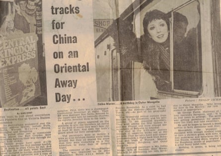 Photo of newspaper article with image of Ildiko leaning out of a train window and waving