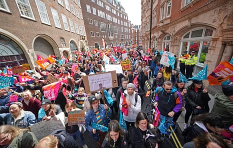 Teachers from the National Education Union (NEU), who are on strike today, marching outside the Department for Education in London.