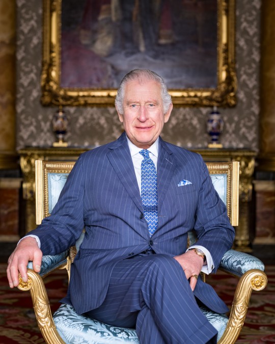 King Charles III coronation MANDATORY CREDIT: Hugo Burnand EDITORIAL USE ONLY This photograph can not be used after 0001 Tuesday May 9, 2023, without prior, written permission from Royal Communications. After that date, no further licensing can be made. Any questions relating to the use of the photographs should be first referred to Buckingham Palace before publication. The portrait should be used only in the context of Their Majesties' Coronation. The photograph is provided to you strictly on condition that you will make no charge for the supply, release or publication of it and that these conditions and restrictions will apply (and that you will pass these on) to any organisation to whom you supply it. There shall be no commercial use whatsoever of the photograph (including by way of example only) any use in merchandising, advertising or any other non-news editorial use. The photograph must not be digitally enhanced, manipulated or modified in any manner or form. Handout photo dated March 2023 issued by Buckingham Palace of King Charles III taken by Hugo Burnand in the Blue Drawing Room at Buckingham Palace, London. Three new portraits of King Charles III and the Queen Consort taken last month by photographer Hugo Burnand have been released. He is wearing an Anderson & Sheppard suit and a Turnbull & Asser shirt, and seated in one of a suite of twelve giltwood and silk upholstered armchairs dating to 1828 and supplied to King George IV for the furnishing of Windsor Castle,. Behind the King is the State Portrait of King George V, painted by Luke Fildes shortly after his coronation. Issue date: Friday April 28, 2023. PA Photo. See PA story ROYAL Coronation Portrait. Photo credit should read: Hugo Burnand/Royal Household 2023/PA Wire NOTE TO EDITORS: This handout photo may only be used for editorial reporting purposes for the contemporaneous illustration of events, things or the people in the image or facts mentioned in the caption. Reuse of the picture may require further permission f