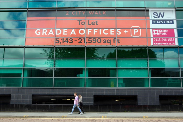 People walking past empty office space to let in Leeds city centre