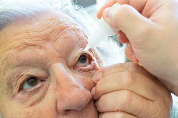 Doctor applies drops to hydrate the old woman's eye. Medical and health concept