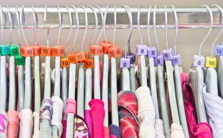 Casual tops on hangers in a charity store